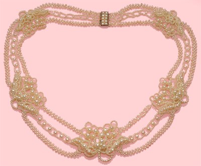 Lot 453 - A Seed Pearl Necklace, five panels of pearls arranged in floral and foliate style, and secured to a