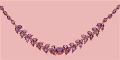 Lot 454 - An Amethyst Necklace, the oval cut amethysts throughout, in a chevron formation to the front of the