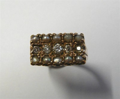 Lot 466 - A 9 Carat Gold Pearl and Diamond Ring, the oblong ring head set with a row of old cut diamonds...