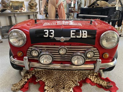 Lot 23 - An Unusual 1964 Monte Carlo Rally Replica Mini Front End, in the form of a desk, modern, with glass