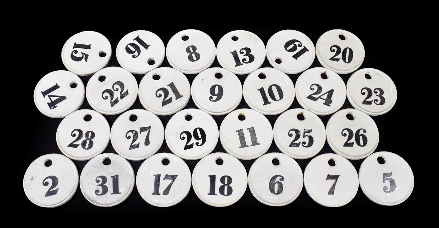 Lot 22 - ~ A Set of Twenty-Eight Creamware Bin Labels, 19th century, of circular form, painted in black with