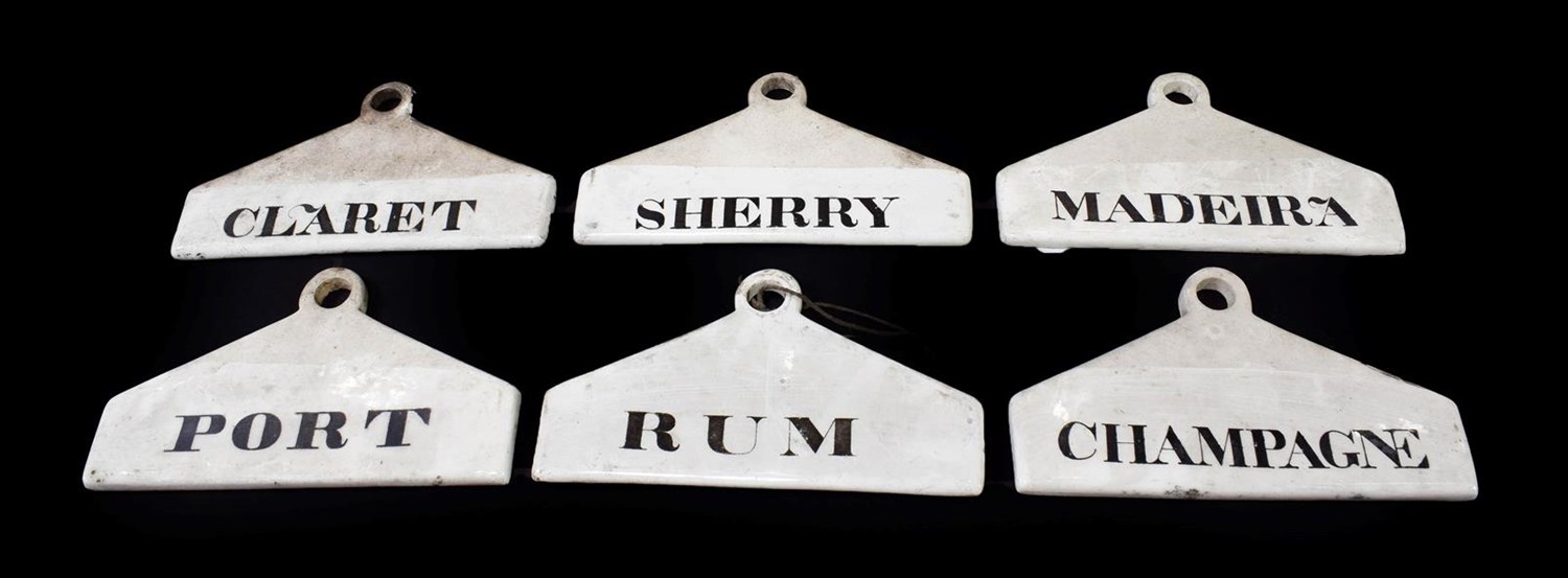 Lot 24 - ~ Six Creamware Bin Labels, 19th century, inscribed in black RUM, SHERRY, MADEIRA, CHAMPAGNE,...