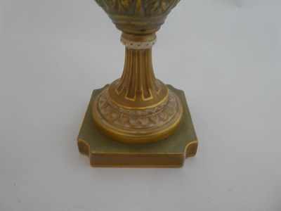 Lot 33 - ^ A Royal Worcester Porcelain Vase, by Frank Roberts, 1911, of slender baluster form with mask...