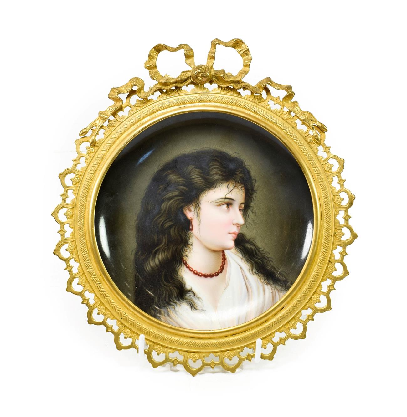 Lot 57 - A Vienna Style Porcelain Saucer Dish, circa 1900, painted with a bust portrait of a girl,...