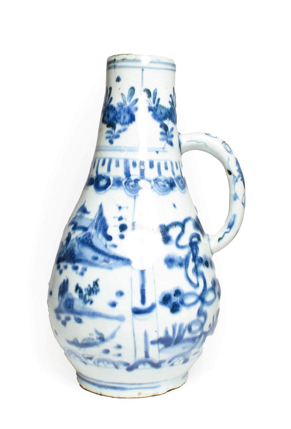 Lot 68 - A Kraak Porcelain Ewer, early 17th century, of pear shape with loop handle, typically painted...
