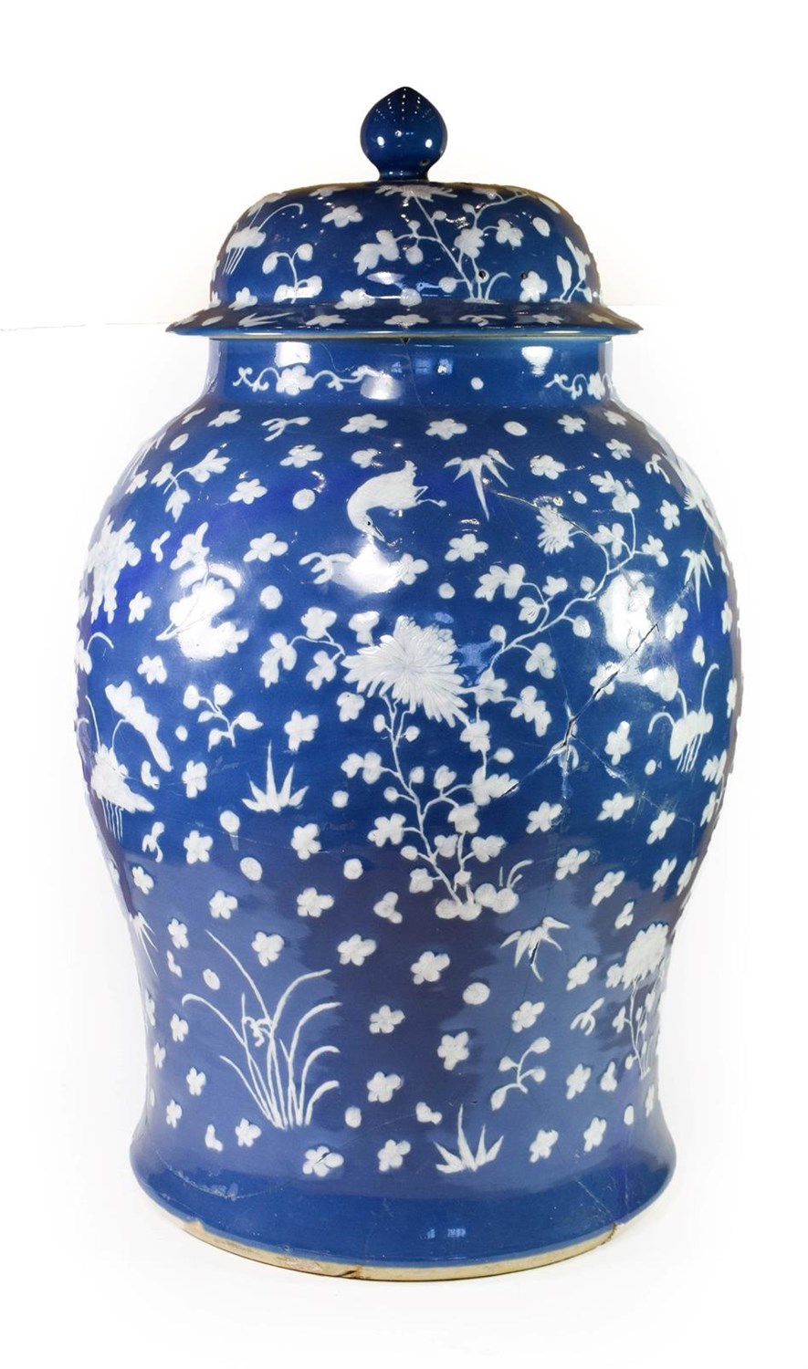Lot 71 - A Chinese Porcelain Baluster Jar and Cover, 18th century, decorated in relief with birds...