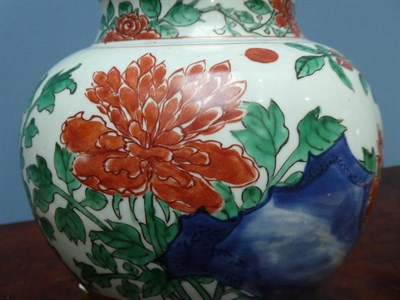 Lot 77 - A Chinese Wucai Porcelain Jar and Cover, mid 17th century, of baluster form, painted with birds and