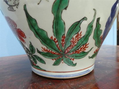 Lot 77 - A Chinese Wucai Porcelain Jar and Cover, mid 17th century, of baluster form, painted with birds and
