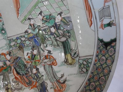 Lot 79 - A Chinese Porcelain Dish, Kangxi, painted in famille verte enamels with a lady mounting a horse and
