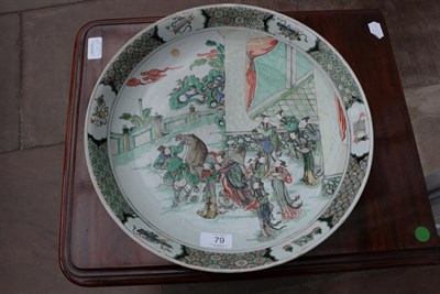 Lot 79 - A Chinese Porcelain Dish, Kangxi, painted in famille verte enamels with a lady mounting a horse and