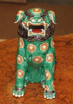Lot 85 - A Pair of Chinese Porcelain Temple Guardians, in 18th century style, modelled as seated lion...