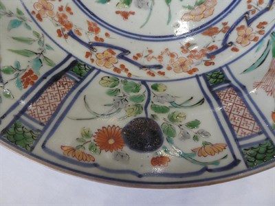 Lot 89 - An Arita Porcelain Dish, circa 1700, painted in colours in Kraak style with a central jardiniere of