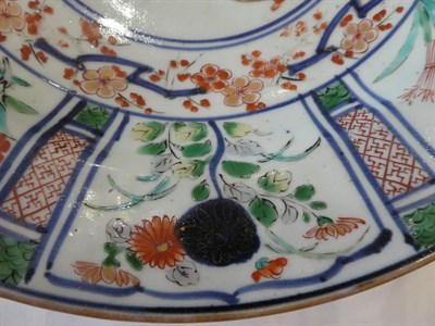 Lot 89 - An Arita Porcelain Dish, circa 1700, painted in colours in Kraak style with a central jardiniere of
