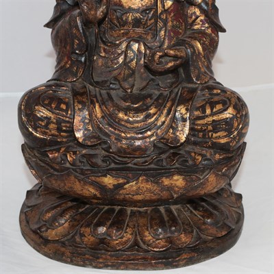Lot 94 - A Chinese Gilt and Lacquered Wood Figure of Buddha, probably 16th century, carved seated in...