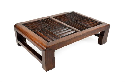 Lot 101 - A Chinese Hardwood Stand, of rectangular form with carved and pierced fretwork, on four legs...
