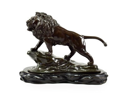Lot 106 - A Japanese Bronze Figure of a Lion, Meiji period, standing on a rocky promontory with waves...