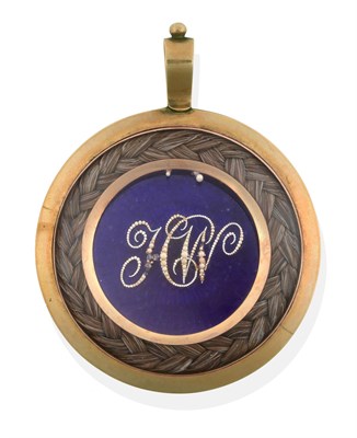 Lot 141 - ~ A Victorian Mourning Pendant, a circular blue enamel plaque overlaid with the initials 'HW'...
