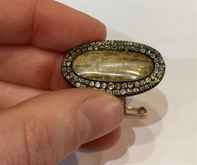Lot 142 - ~ A Regency Diamond Mourning Brooch, the central oval locket compartment containing hairwork within