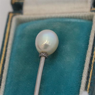 Lot 152 - ~ A Pearl and Diamond Stickpin, the pearl with a rose cut diamond collar in white millegrain...