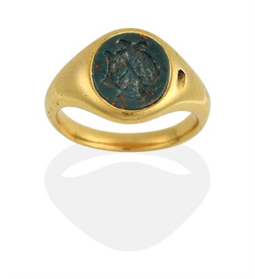 Lot 156 - ~ A Bloodstone Signet Ring, the oval intaglio seal engraved with initials, inset into a yellow...