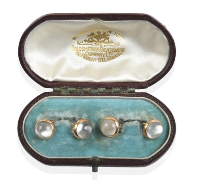 Lot 157 - ~ A Pair of Rock Crystal Cufflinks, the round cabochon rock crystal in yellow rubbed over settings