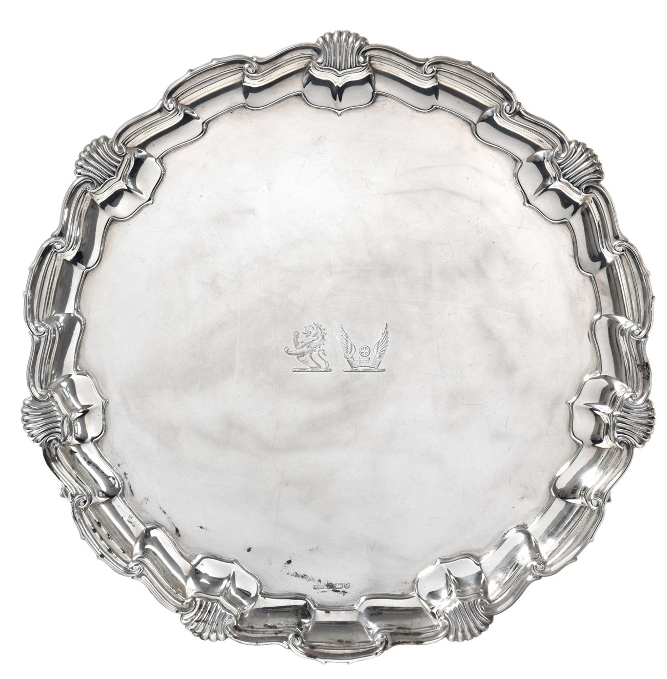 Lot 180 - ~ A George V Silver Salver, by Mappin and Webb, Sheffield, 1910, shaped circular and on scroll...
