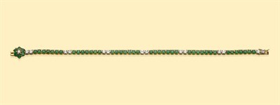 Lot 492 - An Emerald and Diamond Bracelet, round brilliant cut emeralds spaced at intervals by pairs of round