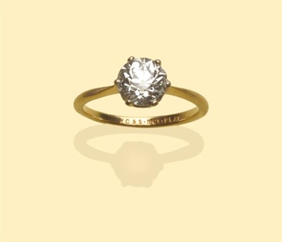 Lot 493 - A Diamond Solitaire Ring, the old brilliant cut diamond in a white six claw setting to a yellow...