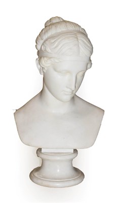 Lot 238 - After the Antique: A White Marble Bust of Venus, her hair tied up, on a waisted circular socle,...