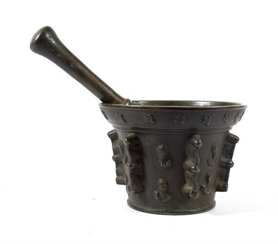 Lot 240 - A Bronze Pestle and Mortar, probably French, 17th century, the mortar cast with fleur de lys...