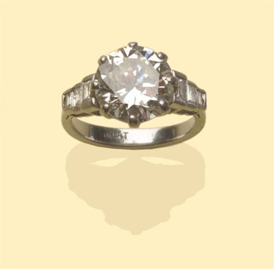 Lot 495 - A Diamond Solitaire Ring, the round brilliant cut diamond in a white eight claw setting, with three