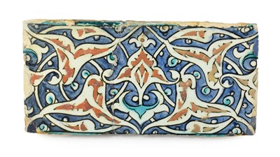 Lot 277 - An Isnik Pottery Tile, circa 1580, painted in red bole, black, blue and turquoise with rolling...