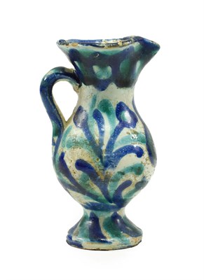 Lot 278 - An Islamic Faience Small Ewer, probably Damascus, 18th/19th century, of baluster form, painted...