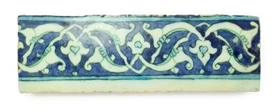 Lot 288 - An Isnik Border Tile, late 16th century, painted in blue and turquoise with scrolling stylised...