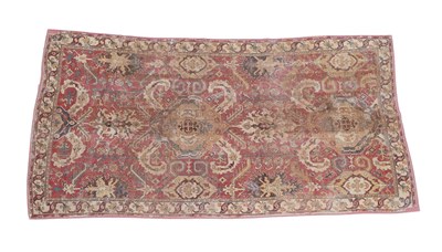 Lot 296 - South Caucasian Carpet, late 18th/early 19th century The madder field with a column of full and...