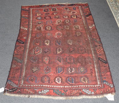 Lot 299 - Rare Baluch Rug East Iran/Afghan Frontier, circa 1880 The terracotta field with a oneway design...