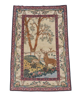 Lot 318 - Finely Woven Kashan Rug Central Iran, circa 1940 The champagne field depicting a stag, hind and...