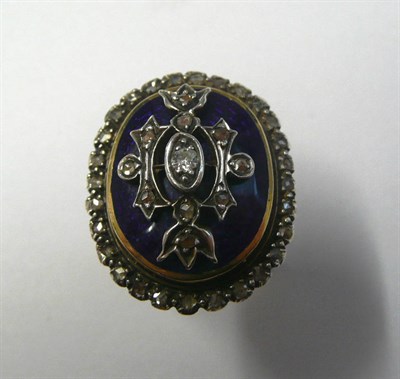 Lot 502 - A Diamond and Enamel Mourning Ring, the domed head enamelled in blue, and overlaid with a design of