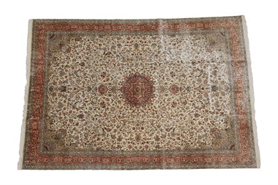 Lot 323 - Silk Piled Kashmir Carpet, modern The ivory field with an allover design of flowers and vines...