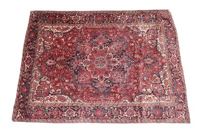 Lot 325 - Heriz Carpet Iranian Azerbaijan, 20th century The brick red field of angular vines centred by a...