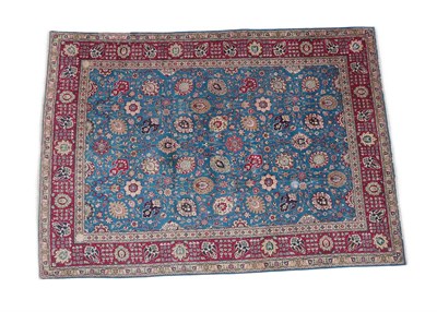 Lot 330 - Tabriz Carpet North West Iran, 2nd half 20th century The mid indigo field of large palmettes...