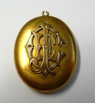 Lot 503 - A Victorian Locket, the plain polished oval locket with overlaid initials 'EJC' to the front,...