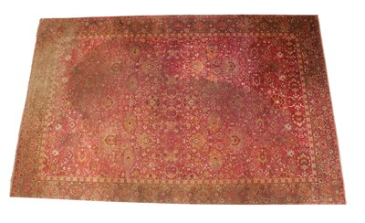 Lot 337 - ~ Large Indian Carpet, early 20th century  The raspberry field with an all over design of palmettes