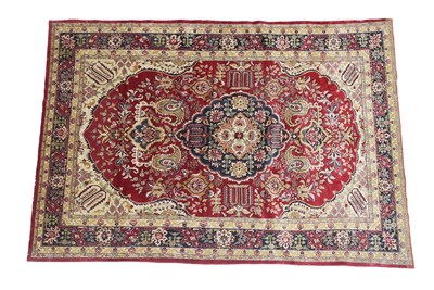 Lot 348 - Tabriz Carpet Iranian Azerbaijan, 20th century The blood red field of vines around an indigo...