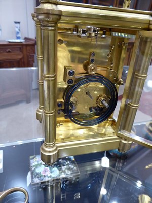 Lot 400 - A Brass Striking and Repeating Carriage Clock, signed Henri Jacot, circa 1890, carrying handle...