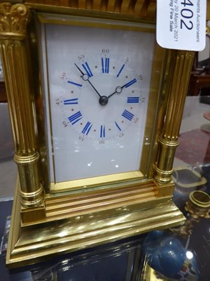 Lot 402 - <> A Brass Striking and Repeating Carriage Clock, circa 1890, carrying handle and repeat...