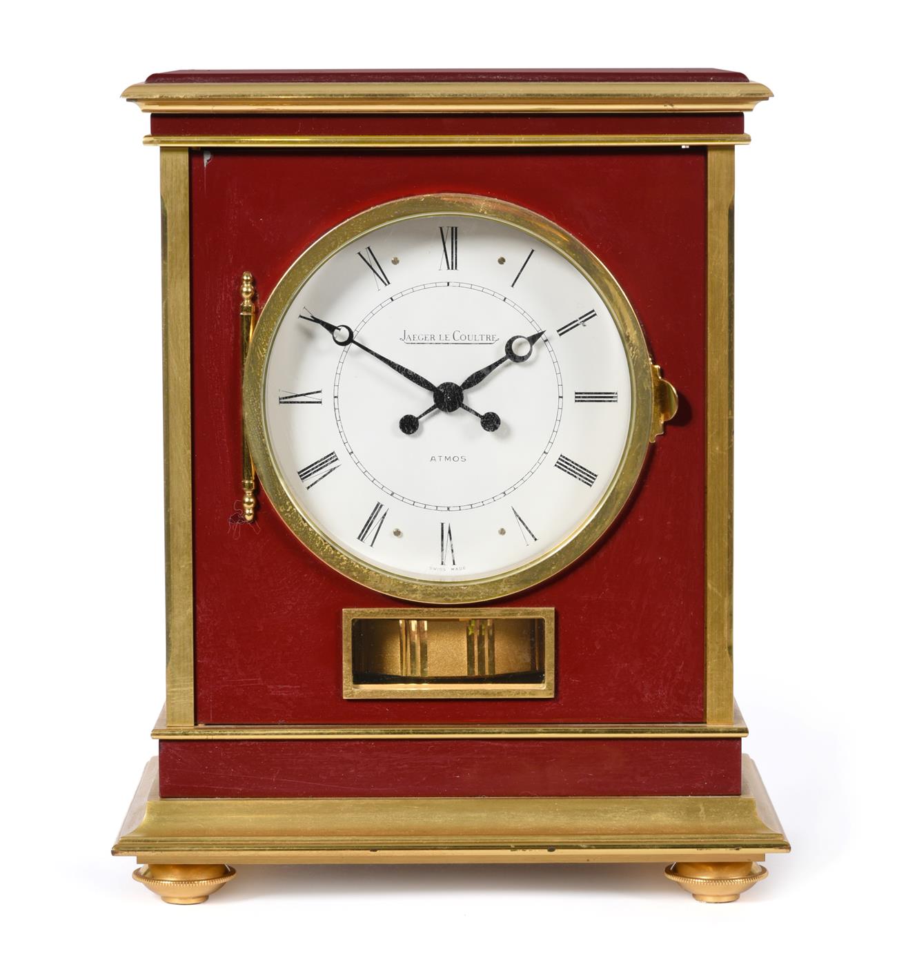 Lot 405 - A Brass and Red Lacquered Atmos Clock, signed Jaeger LeCoultre, model: Embassy, 20th century,...