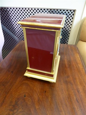 Lot 405 - A Brass and Red Lacquered Atmos Clock, signed Jaeger LeCoultre, model: Embassy, 20th century,...