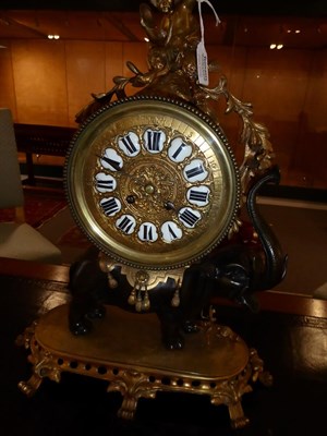 Lot 411 - An Ormolu and Bronze Striking Elephant Mantel Clock, circa 1890, surmounted by a cherub, bronze...