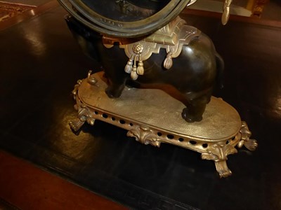 Lot 411 - An Ormolu and Bronze Striking Elephant Mantel Clock, circa 1890, surmounted by a cherub, bronze...